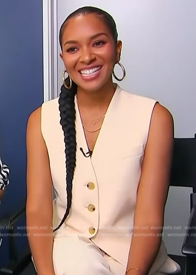 Lizzy Mathis’s beige vest on Access Hollywood