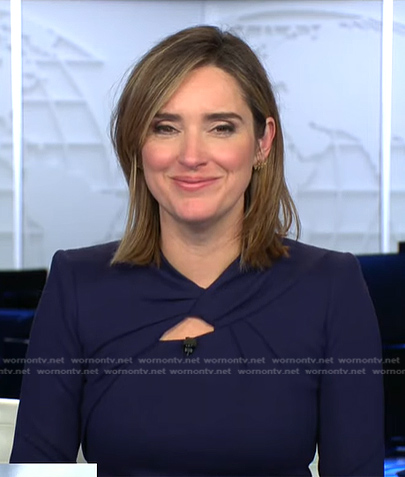 Margaret's navy twisted neck dress on CBS Evening News