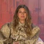 Marisa Tomei’s gold metallic bow jacket on Extra