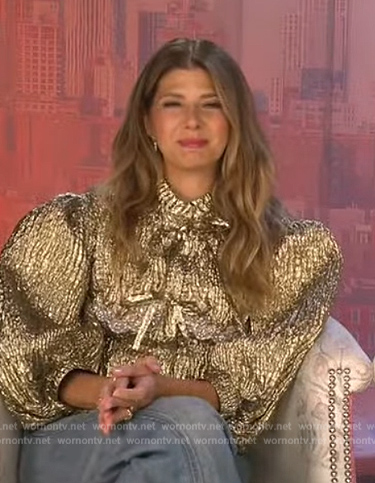 Marisa Tomei's gold metallic bow jacket on Extra