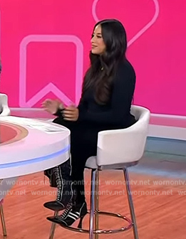 Naz Perez’s black contrast trim boots on Today