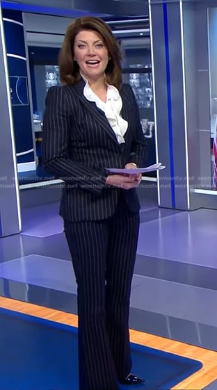Norah's navy pinstripe suit on CBS Evening News