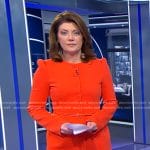 Norah's orange belted jacket and cropped pants on CBS Evening News