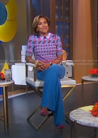 Robin’s geometric polo sweater and blue pants on Good Morning America