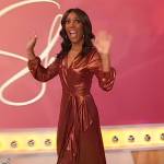 Shaun Robinson’s bronze metallic ruffle wrap dress on Sherri