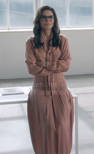 Sheila's pink tie neck blouse and skirt on American Horror Stories