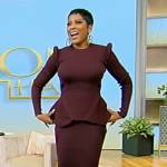 Tamron’s burgundy asymmetrical sweater and skirt on Tamron Hall Show