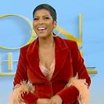 Tamron’s red velvet feather trim blazer on Tamron Hall Show