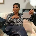 Tamron’s black geometrical print blouse on Tamron Hall Show