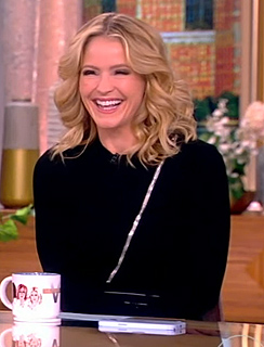 Sara’s black zip front sweater on The View