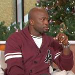 Akbar’s burgundy varsity cardigan on The Talk