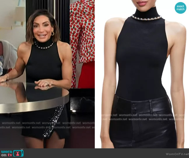 Alice + Olivia Annalee Beaded Mock Neck Knit Tank worn by Courtney Lopez on E! News