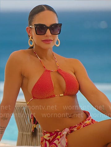 Amanza's red metallic bikini, embellished pumps and printed pareo on Selling Sunset