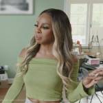 Candiace’s green off shoulder sweater and jeans on The Real Housewives of Potomac