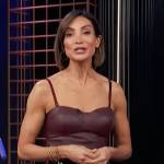 Courtney Mazza’s burgundy leather bodysuit on E! News