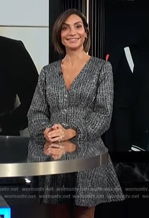 Courtney Lopez’s gray metallic long sleeve dress on E! News