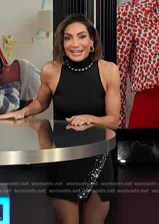 Courtney Lopez's black pearl neck top and skirt on E! News