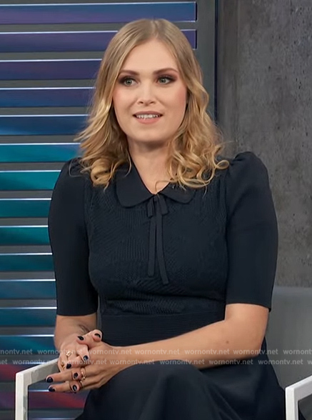 Eliza Taylor’s navy pointelle knit dress on Access Hollywood