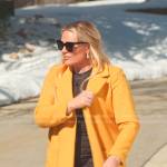 Heather’s black mini dress and yellow coat on The Real Housewives of Salt Lake City