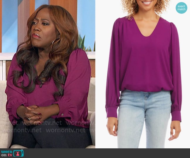 Karen Kane Puff Sleeve V-Neck Crepe Blouse in Magenta worn by Sheryl Underwood on The Talk