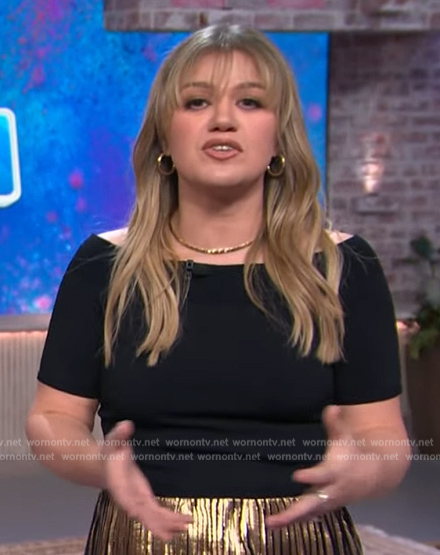 Kelly's black off shoulder top and metallic skirt on The Kelly Clarkson Show
