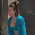 Kim’s blue sports bra and hoodie on The Kardashians