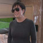 Kris’s black crew neck top and earrings on The Kardashians