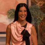 Lisa Ling’s pink satin contrast tie top on The Drew Barrymore Show