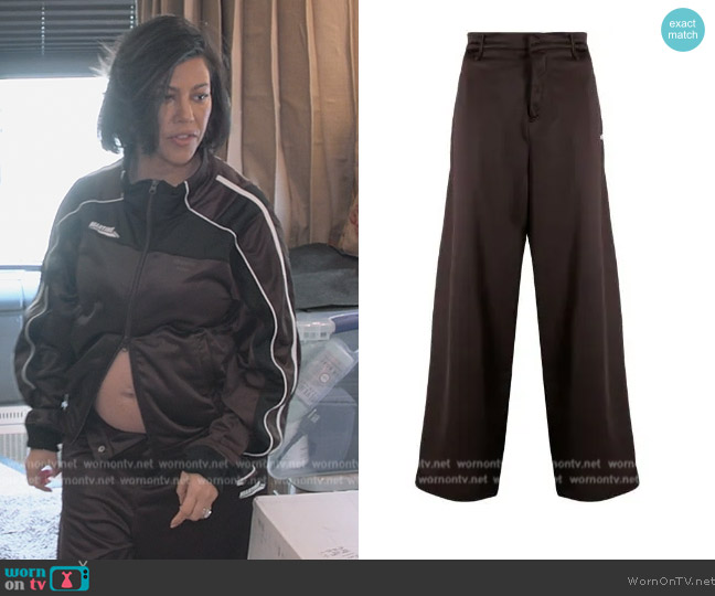 Martine Rose Satin wide-leg trousers worn by Kourtney Kardashian (Kourtney Kardashian) on The Kardashians