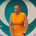 Michelle Miller’s orange midi dress on CBS Saturday Morning