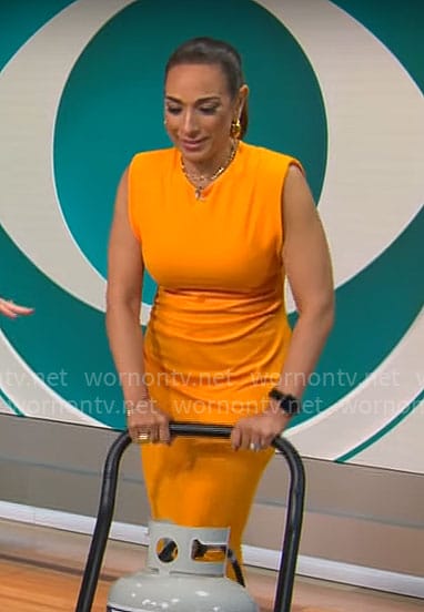 Michelle Miller’s orange midi dress on CBS Saturday Morning