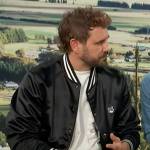 Nick Viall’s black varsity bomber jacket on Access Hollywood