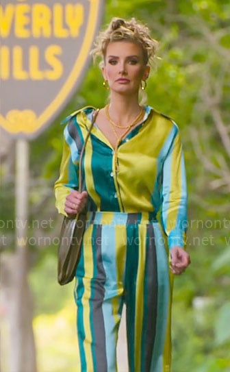 Nicole's blue and lime green striped blouse and pants set on Selling Sunset