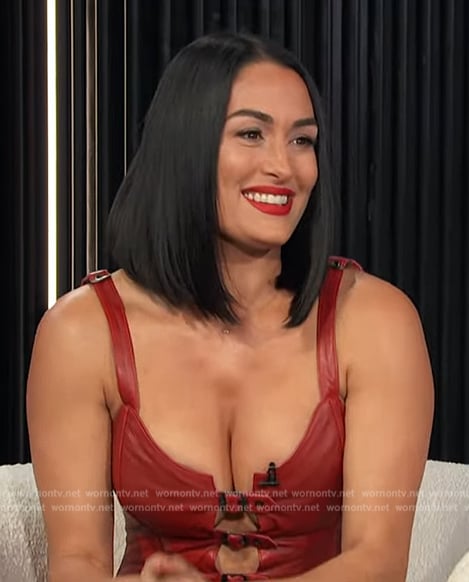 Nikki Garcia's red buckle strap top on E! News