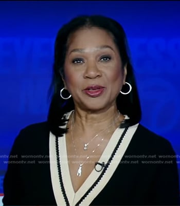 Sandra Bookman’s black contrast v-neck sweater on Good Morning America