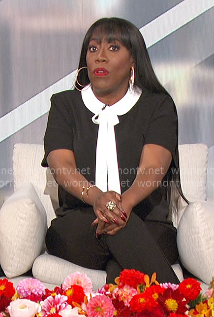 Sheryl's black top with white collar and tie on The Talk