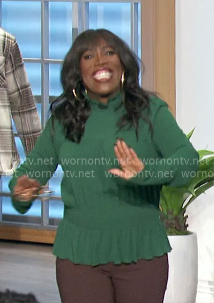 Sheryl’s green ruffle hem top on The Talk