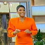 Tamron’s orange v-neck mini dress on Tamron Hall Show