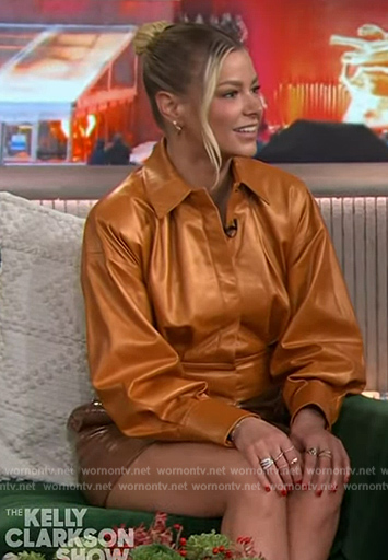 Ariana's brown leather mini skirt and orange shirt on The Kelly Clarkson Show