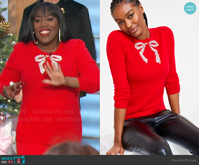 Charter Club Cashmere Embellished Bow Sweater in Calypso Red worn by Sheryl Underwood on The Talk