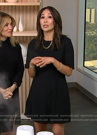 Diane Mizota’s black pleated mini dress on Access Hollywood