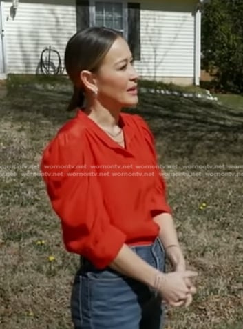 Eva's orange ruched sleeve blouse on Good Morning America