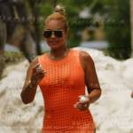 Gizelle’s orange crochet knit dress on The Real Housewives Ultimate Girls Trip