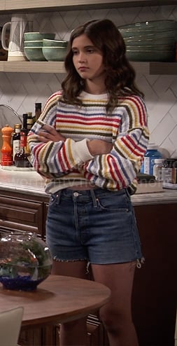 Grace's rainbow striped sweater and denim shorts on Extended Family