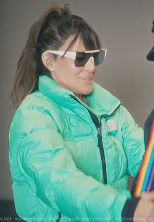 Robin Antin’s green padded jacket on Paris in Love