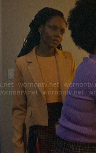 Hazel's peach cropped blazer and check pants on The Other Black Girl