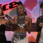 Kara Tenae’s sequin cropped top and feather trim skirt on The Voice