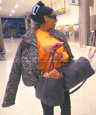 Monica's orange sweatshirt and grey paisley puffer jacket on The Real Housewives of Salt Lake City