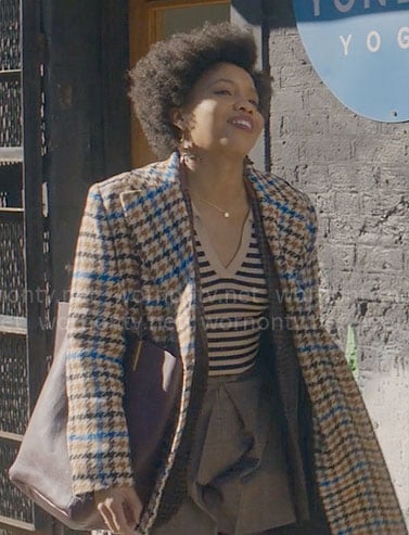 Nella’s houndstooth coat on The Other Black Girl