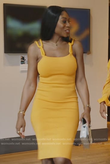 Nneka's orange chain strap dress on The Real Housewives of Potomac